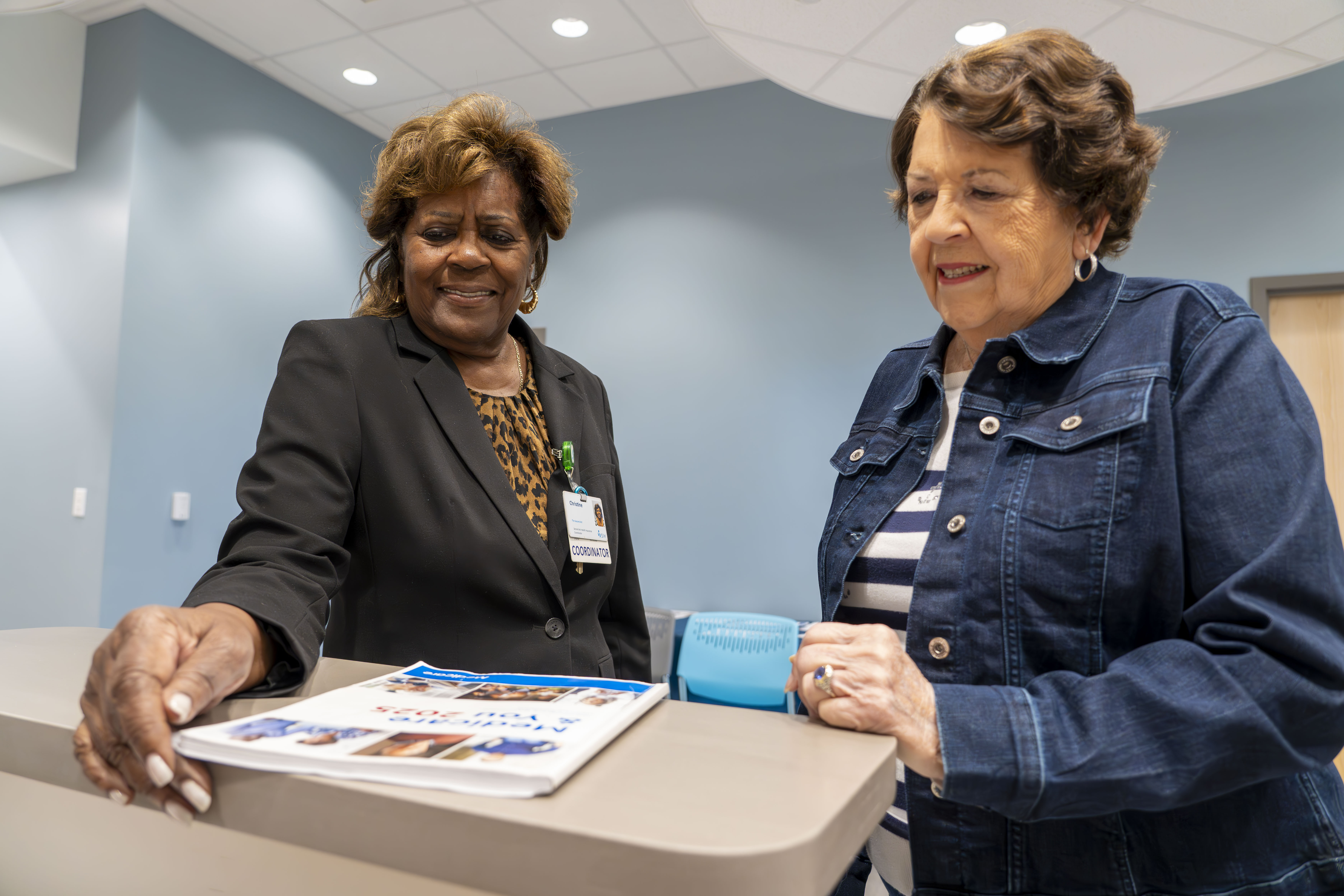 Two elderly women smiling
